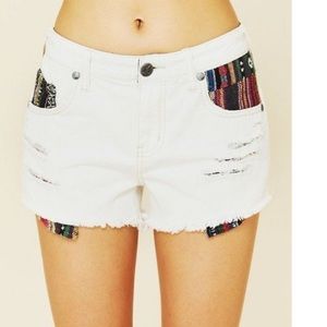Free People white distressed baha shorts, size 27